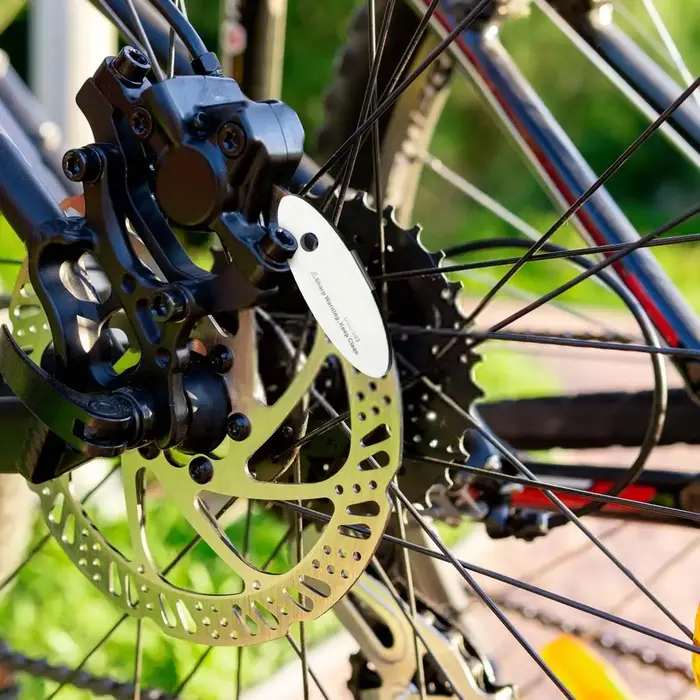Outil de réglage de l'écartement des plaquettes de frein à disque de vélo